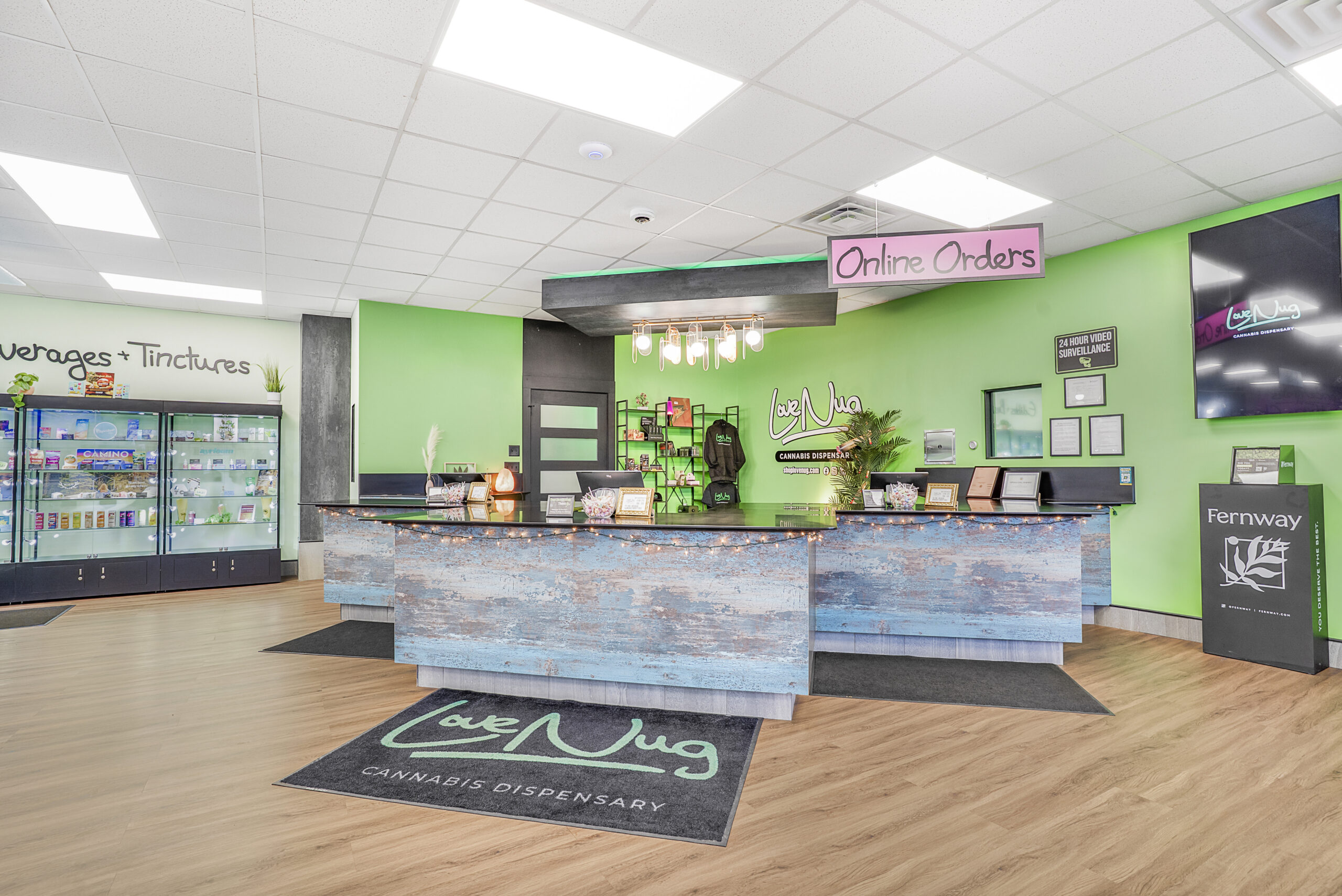 Love Nug dispensary counter with knowledgeable staff helping customers in North Tonawanda NY
